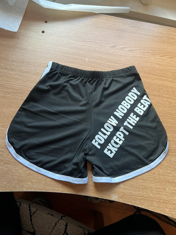 Pantalones cortos deportivos negro Follow nobody except the beat de Nyx Fashion Ibz