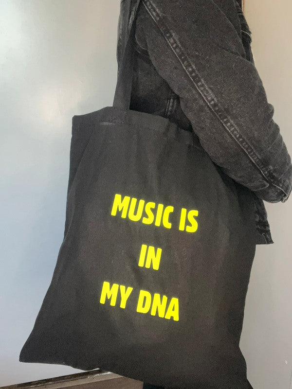 Bolso tote negro Music is in my DNA - Brilla en la oscuridad de Nyx Fashion Ibz
